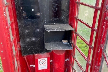 Inside the red phone box before renovation
